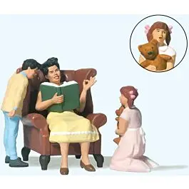 Woman in Chair Reading Aloud to Boy and Girl